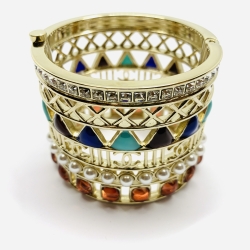 CHANEL - CHANEL, Fall / Winter 2019 collection, Cuff in golden metal embellished with multicolored enamel pattern of Egyptian inspiration. Signed by laser.Cuff